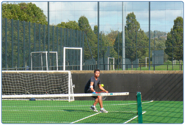 Tennis player at a South Lanarkshire Leisure and Culture court.