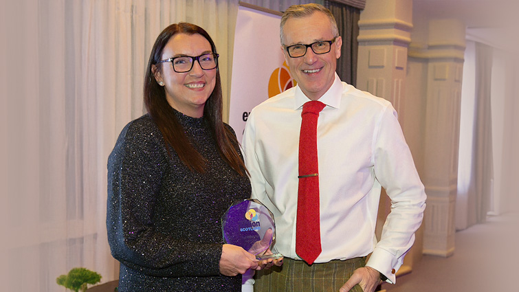 This image shows a council employee accepting the the Outstanding Contribution to Tackling Fuel Poverty (Organisation) at Energy Action Scotland’s Fuel Poverty Awards 2025