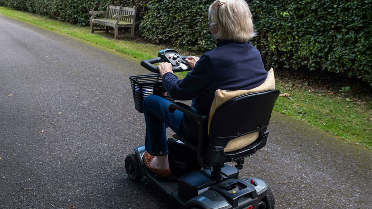 This is generic image of a person using a mobility scooter 