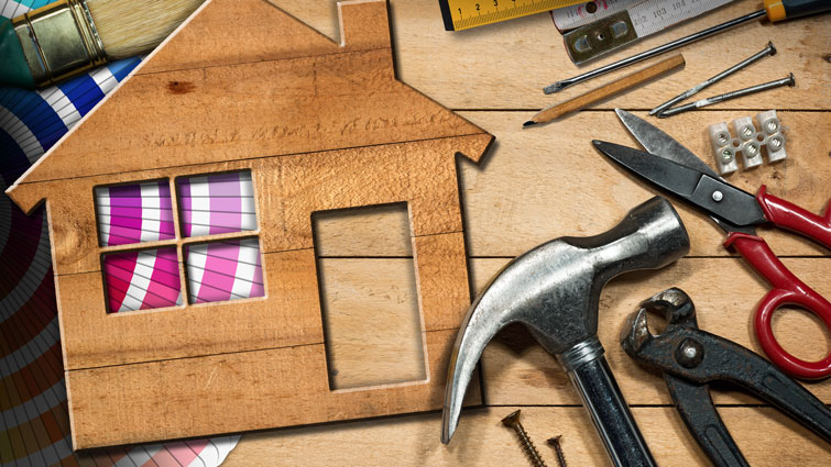 This is an image of some tools with a wooden house cutout