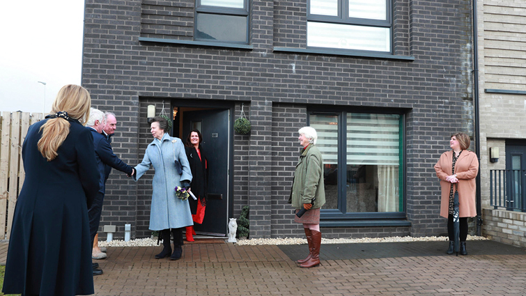 This image shows HRH The Princess Royal on a visit to Whitlawburn