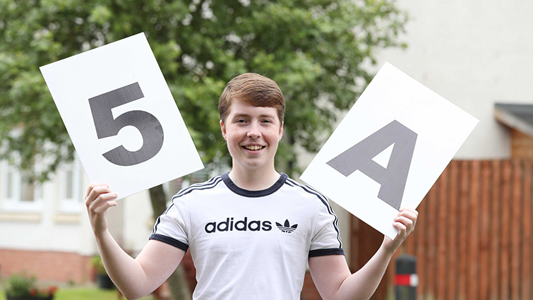 Pupil Edward shows his delight after gaining 5 As in his Highers and suffering a brain tumour