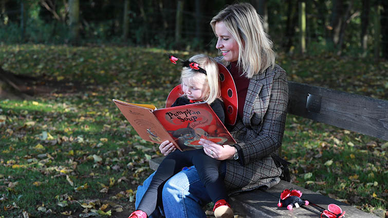 This pic shows a mother and child reading together to mark World Book Day