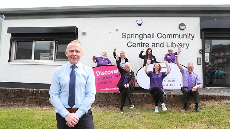 This image shows staff outside Springhall Community Centre and library