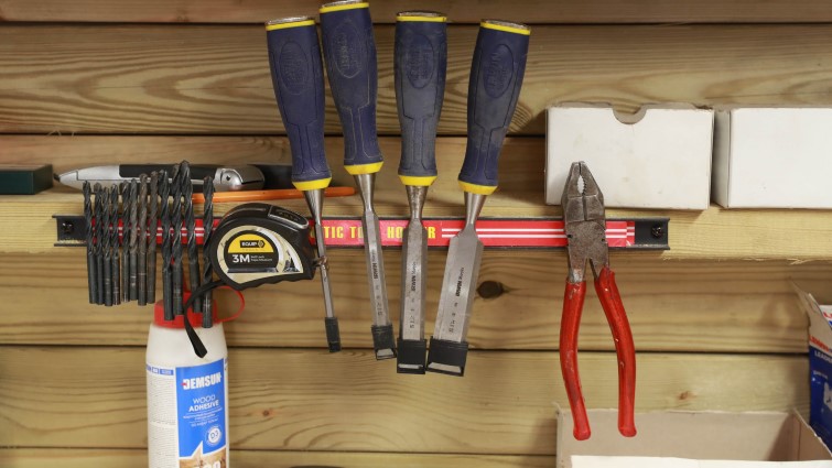 Tools hanging on the inside wall of a men's shed
