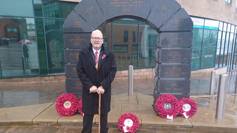 This image shows Depute Provost Bert Thomson at the VC memorial in Hamilton