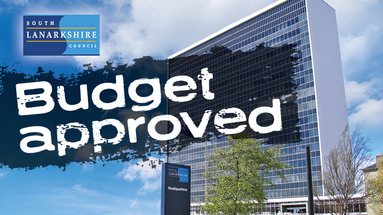 This image shows the council HQ with the words budget approved across the image