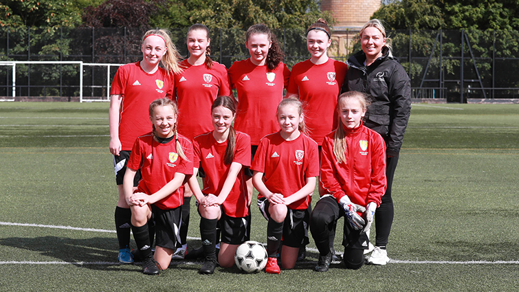 This image shows the girls' football team for the ICG 2022
