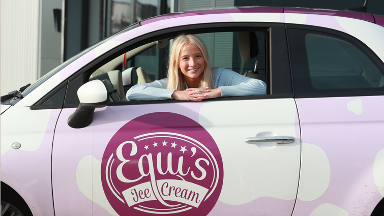 Alex Equi in an Equi's-branded car.