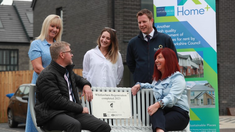 This image shows representatives from the council and partners following the regeneration of the Whitlawburn area