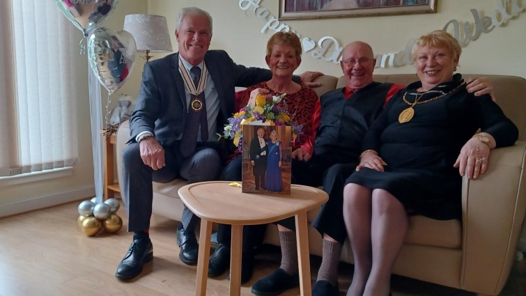 This image shows Mr and Mrs Gibb celebrating their Diamond Wedding Anniversary with Provost Margaret Cooper and Deputy Lieutenant for Lanarkshire Andrew Braidwood