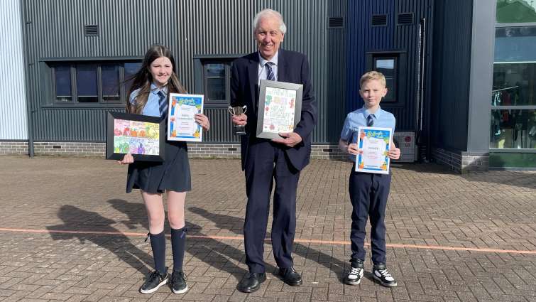 Rocco Johnstone and Lucy Flannigan from Our Lady of Lourdes Primary School in East Kilbride, presented with their winning Go Fresh Poster designs by Councillor Robert Brown, the Chair of the council&rsquo;s Community and Enterprise Resources Committee