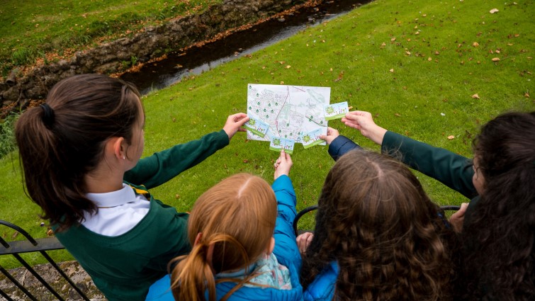 school children with Beat the Street cards