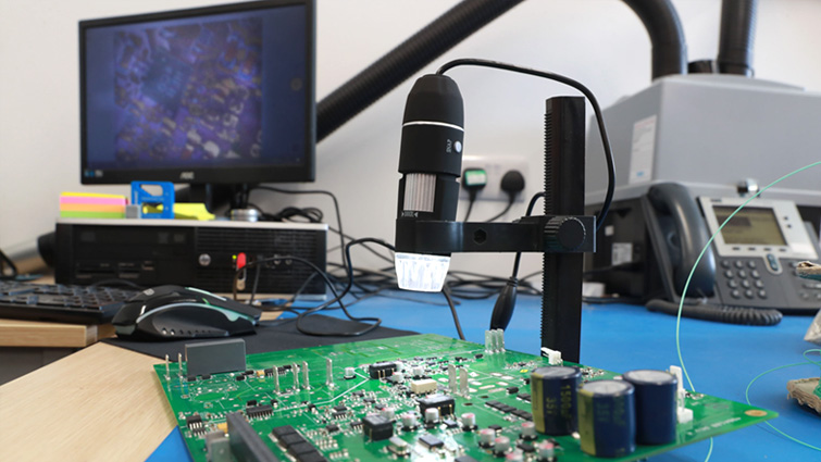 This image shows microchips and a motherboard at Mage Control Systems
