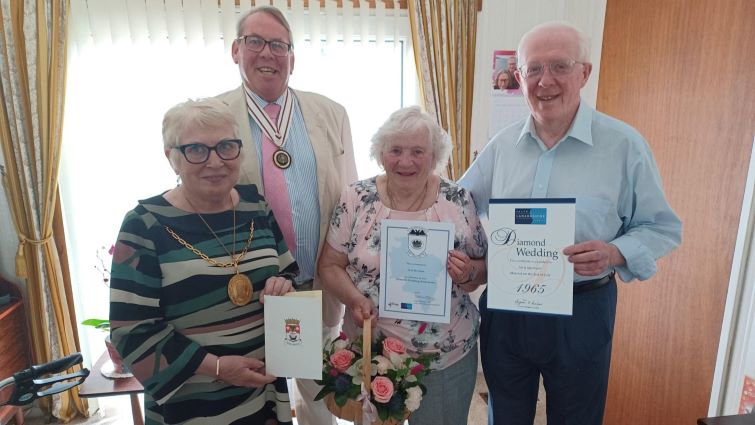 This image shows Mr and Mrs Smith on the Diamond Wedding Anniversary along with Provost Margaret Cooper and Deputy Lord Lieutenant Dr William Morrison Young