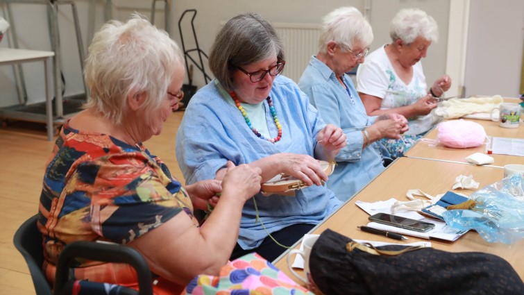This image show members of the Hand Made Arts and Crafts group