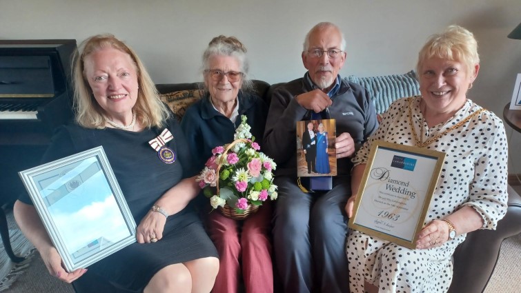 This images shows Mr and Mrs Cunningham celebrating their Diamond Wedding Anniversary with Provost Margaret Cooper and Deputy Lord Lieutenant for Lanarkshire Margaret Morton