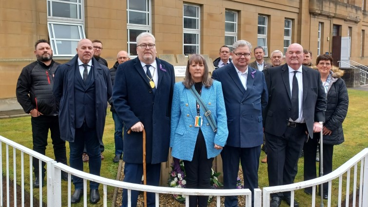 This image shows Depute Provost Bert Thomson, Depute Leader Gerry Convery and representatives from the Trade Unions for International Workers Memorial Day