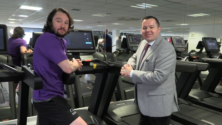This image shows Council Leader Joe Fagan with a member of Leisure and Culture staff at the newly refurbished gym at John Wright Sports Centre