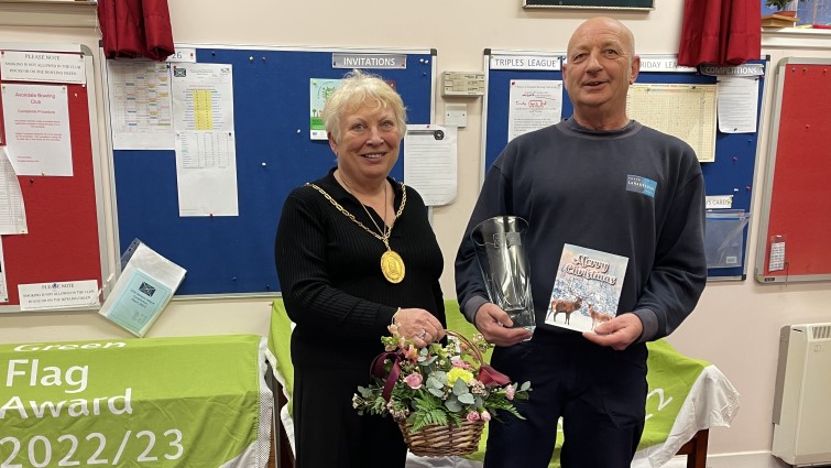 This image shows Provost Margaret Cooper with James Armour after he won joint Employee of the Year at the Green Flag awards