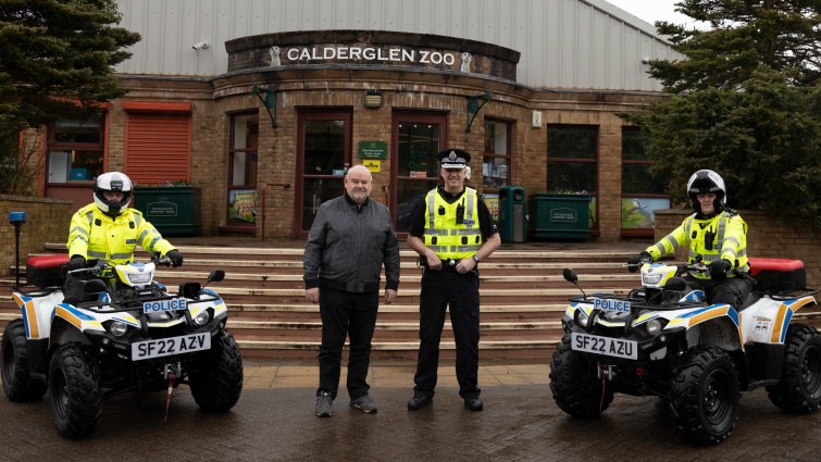 This image shows Councillor Davie McLachlan with police quad bikes and officers