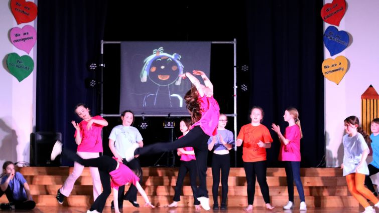 This  is a picture of a group of the young people performing durng the show. 