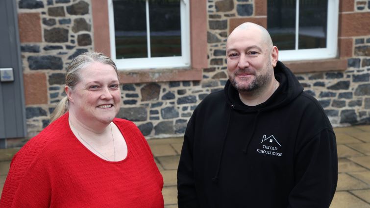 Tommy is pictured standing in front of the Old Schoolhouse building in Abington with his manager Nichola Hilli.