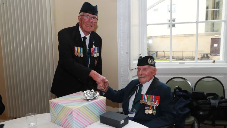 Don Turrell receiving a presentation from a member of the Cameronians Friends and Families Organisation.