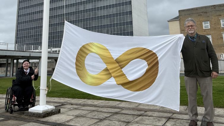 Sophie Davidson raised the Autism Pride flag outside South Lanarkshire Council HQ, with the help of Ramon Hutchingson, Co-ordinator of South Lanarkshire&rsquo;s Autism Resources Co-Ordination Hub (ARCH), to mark International Autism Pride Day 2026.